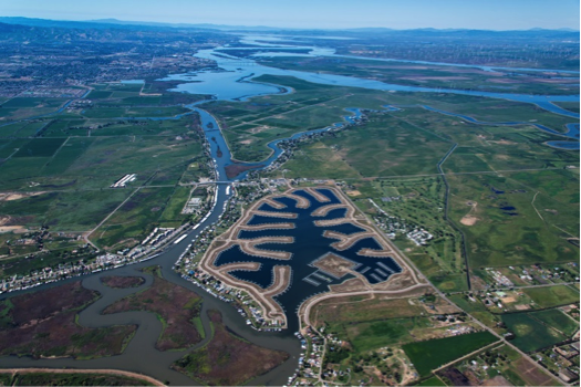 An aerial photo shows the site plan for the Delta Coves development, a master-planned luxury waterfront custom-home community in the Sacramento-San Joaquin Delta area. The plan features 310 acres on Bethel Island. (Courtesy of SunCal) 