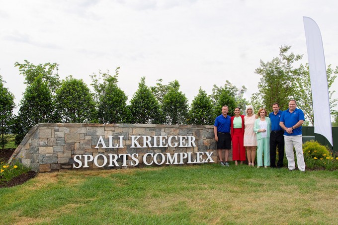ALI KRIEGER SPORTS COMPLEX OPENS AT POTOMAC SHORES – The 30-acre Ali Krieger Sports Complex opened June 9 at the Potomac Shores community being developed by SunCal south of Washington, D.C. U.S. soccer star Ali Krieger was joined for the festivities by nearly 200 persons including local officials and fans. Pictured, left to right, are Ken Krieger, Ali Krieger’s father; namesake Ali Krieger; Debbie Christopher, Ali Krieger’s mother; Prince William County Supervisor Maureen Caddigan; Andrew Wagner, Project Manager, Potomac Shores; and Brian English, Vice President, Land Development Manager, Potomac Shores.