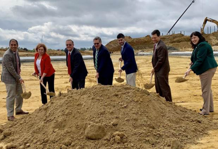 School Board Chairman Babur Lateef, far left, is joined at a May 9 ground-breaking ceremony for the new middle school at Potomac Shores by Supervisor Maureen Caddigan, R-Potomac; Supervisor Frank Principi, D-Woodbridge; Superintendent Steven Walts; School Board member Justin Wilk (Potomac); state Sen. Scott Surovell, D-36th; and School Board member Alyson Satterwhite (Gainesville).
